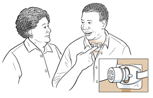 Man placing finger over tracheostomy tube to talk with woman. Inset of cap on tracheostomy tube.